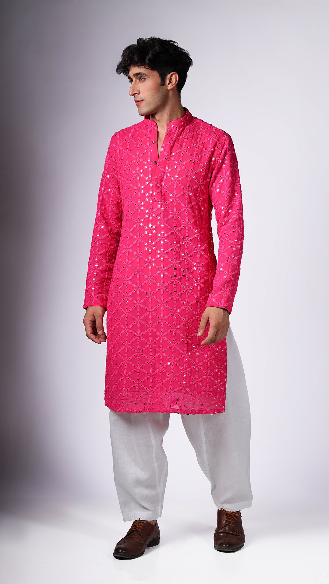 Different angle of Hot Pink Kurta, showcasing sequin embellishments. Paired with salwar and tan Oxford shoes