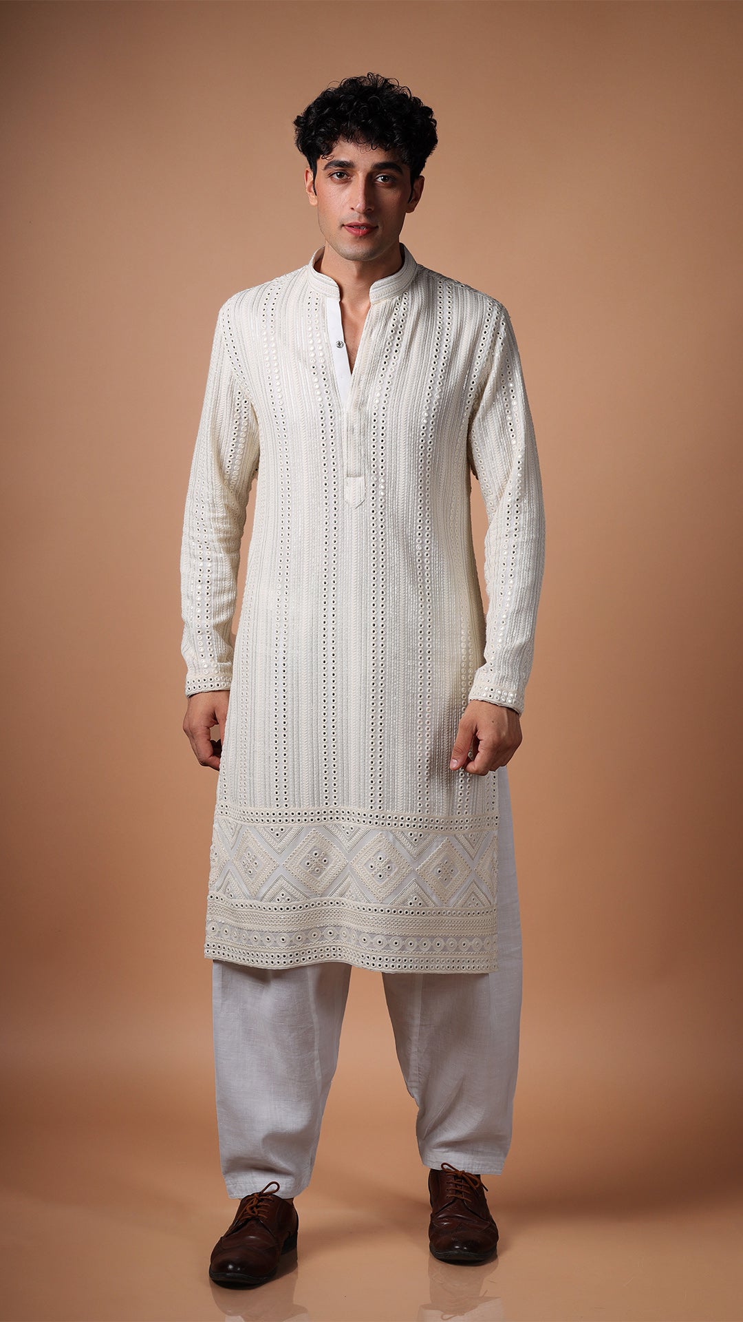 Different angle of Off White Kurta, showcasing vertical panel mirror work. Paired with white patiala and tan Oxford shoes.
