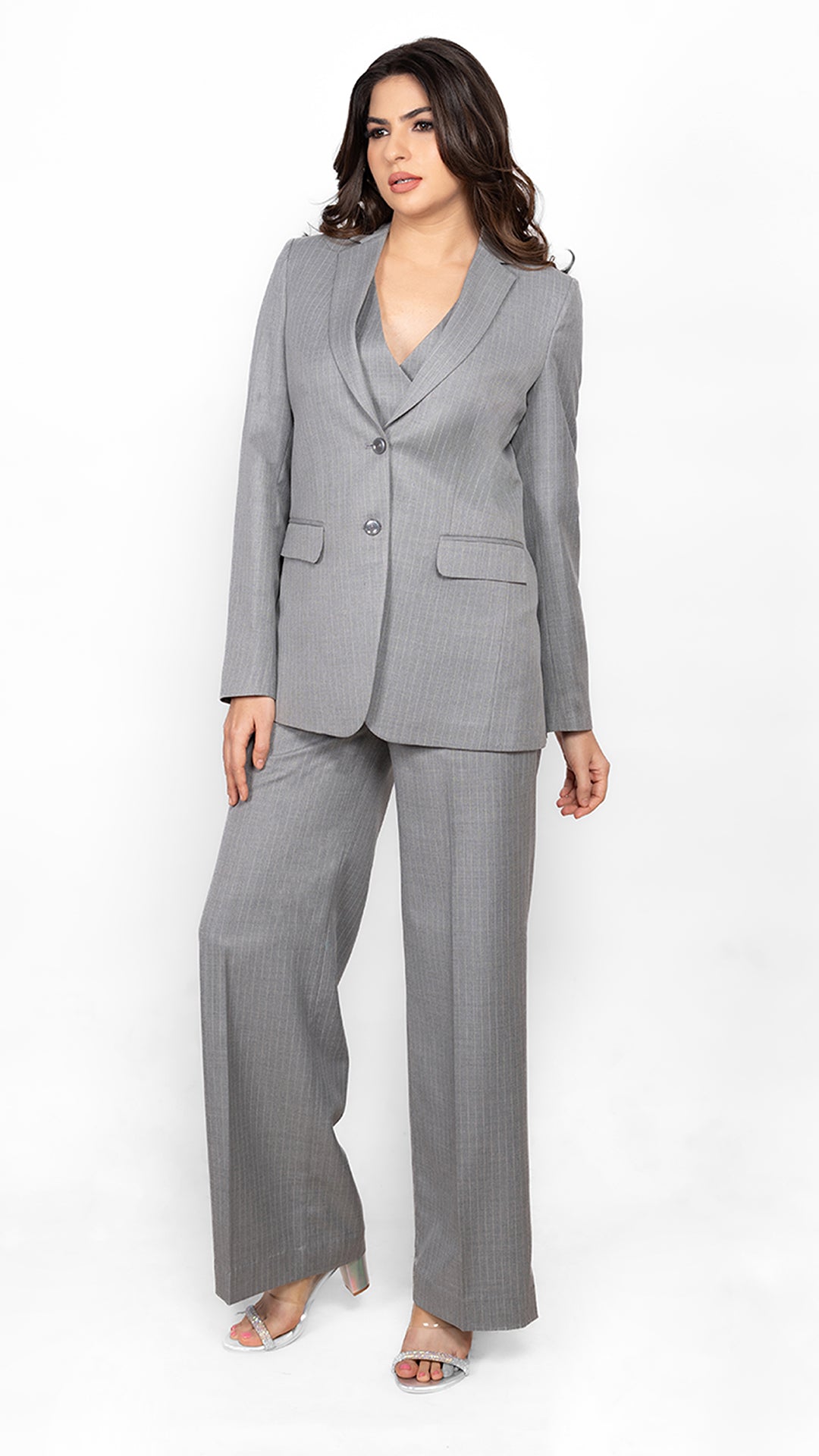 A sleek and sophisticated two-piece suit featuring a structured blazer and straight-fit trousers in grey pinstripes. Perfect for corporate and formal occasions.
