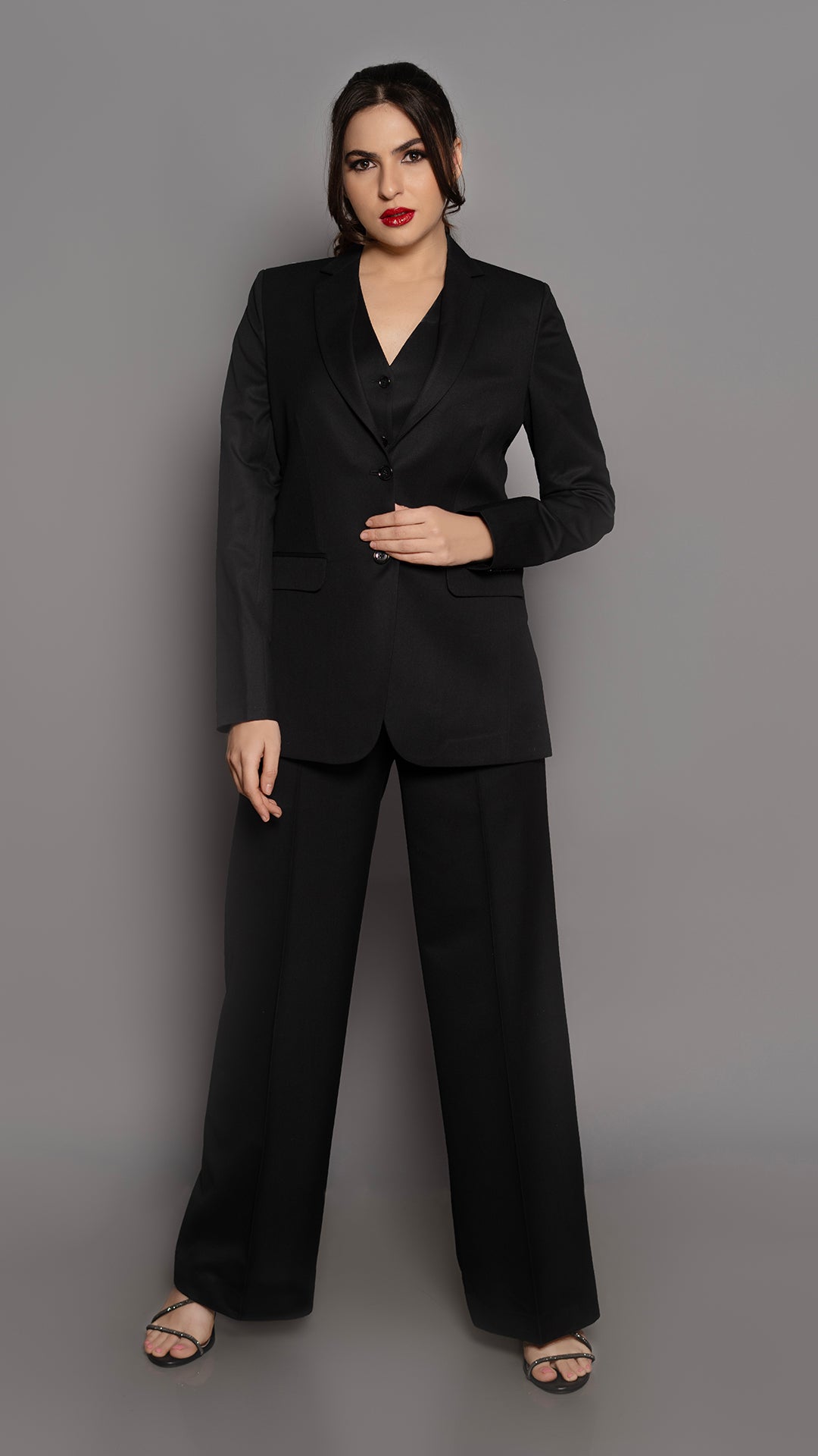 A structured black blazer with a sharp notch lapel and a sleek single-breasted 2-button design. Perfect for formal and professional wear.