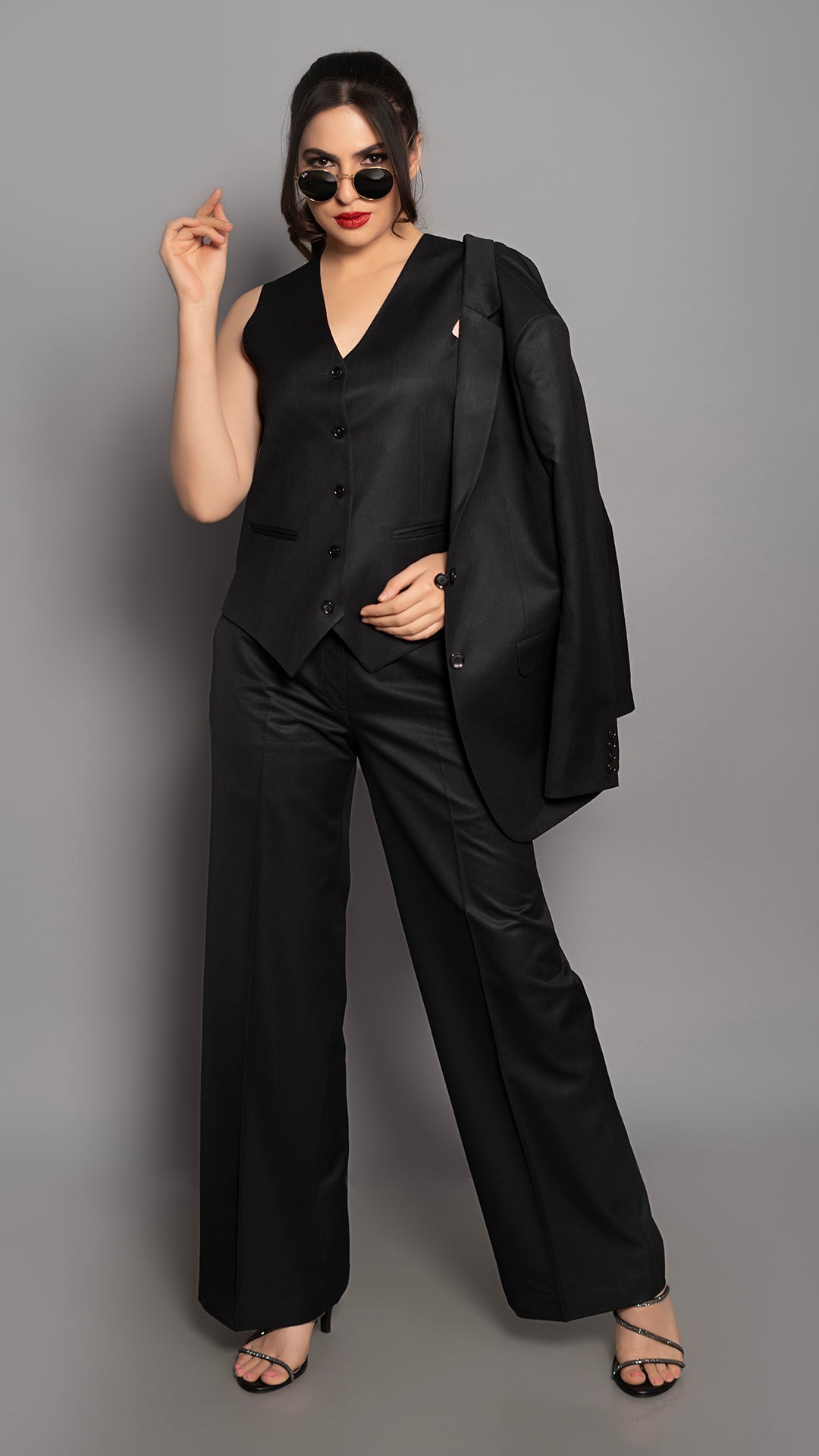 A tailored waistcoat and straight-fit trousers in deep black, designed for a refined and minimal look.