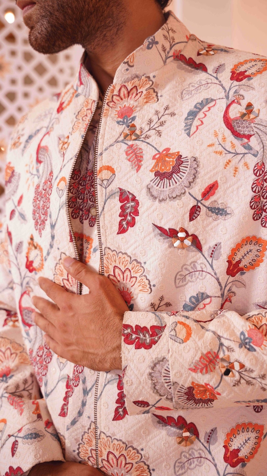 Close up of a floral patterned kurta jacket with intricate designs.