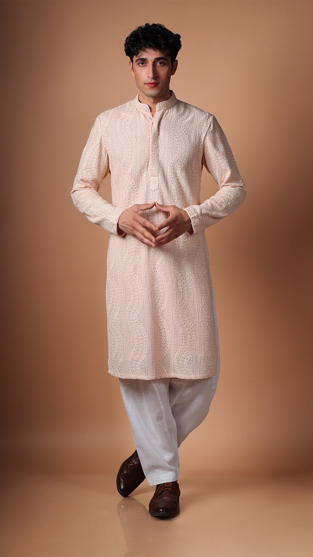 Model in Peach Kurta with Dense Sequin and Mirror Patterns by BWO, paired with salwar and tan Oxford shoes