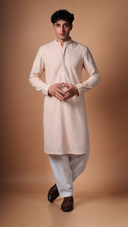 Model in Peach Kurta with Dense Sequin and Mirror Patterns by BWO, paired with salwar and tan Oxford shoes