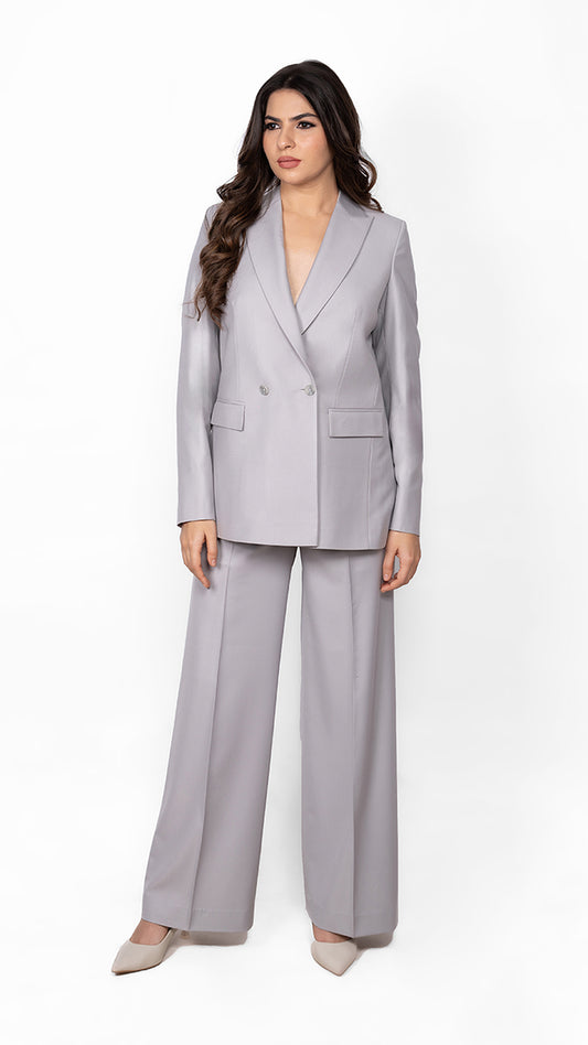 A sophisticated two-piece suit in light grey, crafted with a structured double-breasted blazer and streamlined trousers for effortless power dressing.
