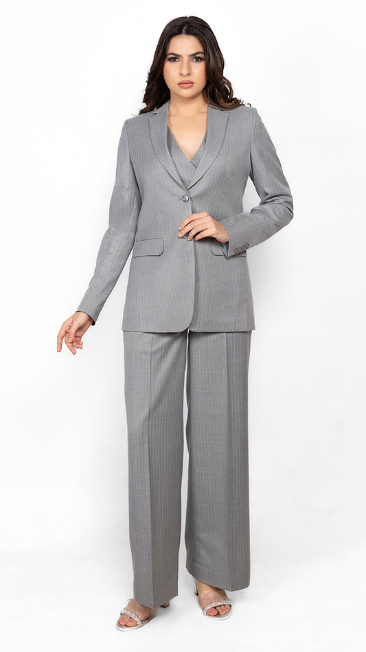 Designed for bold, confident women, this pinstripe three-piece suit in grey offers timeless elegance with structured tailoring and a sharp silhouette.