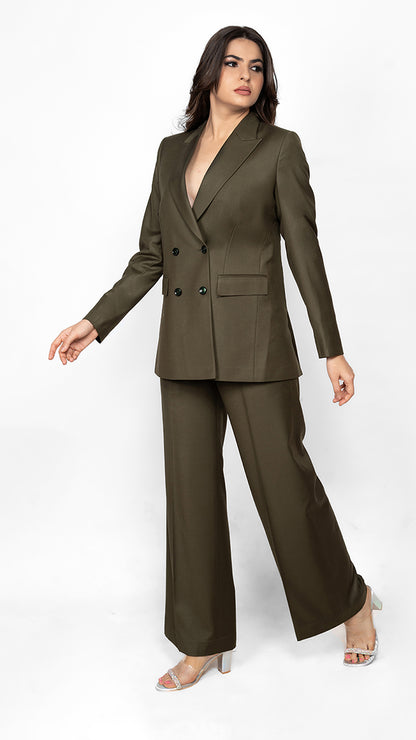 A contemporary two-piece suit featuring a double-breasted blazer and perfectly tailored trousers in olive green, embodying effortless power dressing.