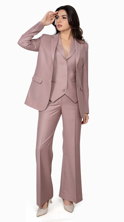 A contemporary three-piece suit featuring a single-breasted blazer, three-button notch lapel waistcoat, and bell-bottom trousers in a soft onion pink hue.

