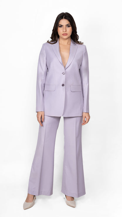 A feminine yet bold lavender suit featuring a precisely tailored blazer and trousers, embodying effortless confidence and style.

