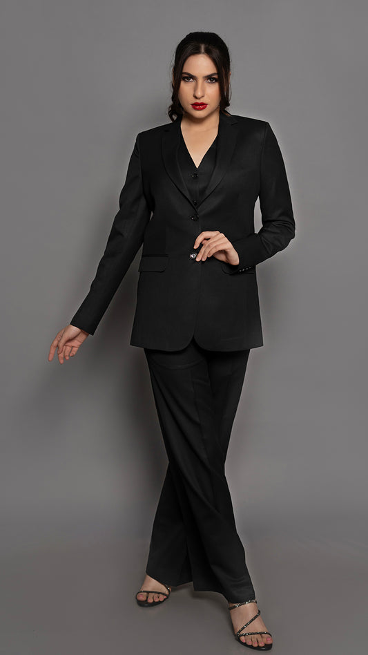 A polished two-piece suit featuring a black blazer and trousers, designed for a commanding yet refined aesthetic.