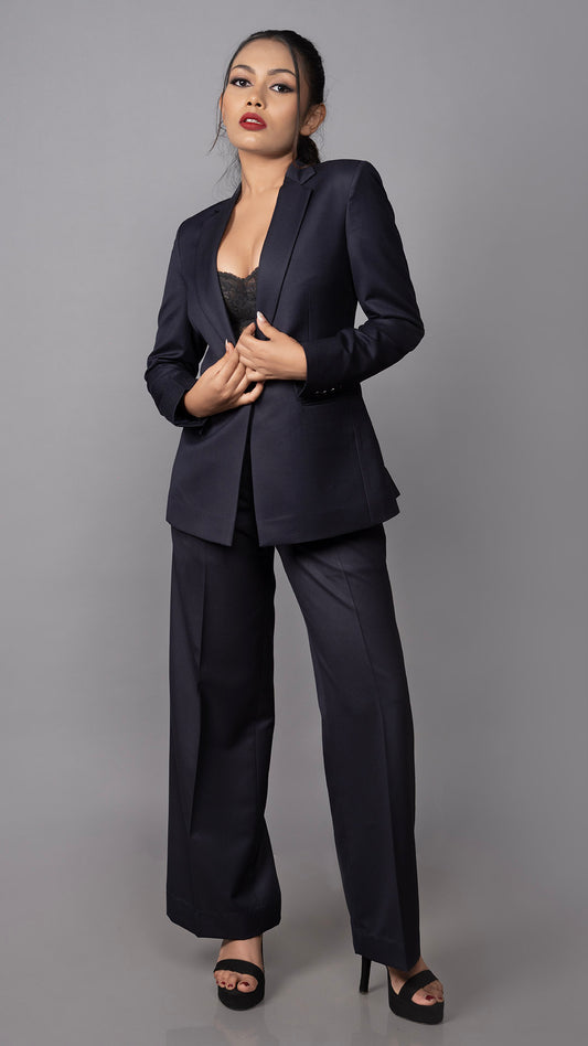 A sleek navy blue suit designed with a one-button blazer and structured trousers, ideal for business and formal wear.