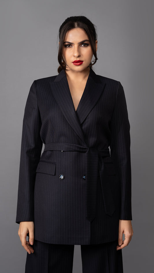 A stylish blue pinstripe blazer with a flattering belted waist, structured peak lapel, and tailored fit for a commanding look.