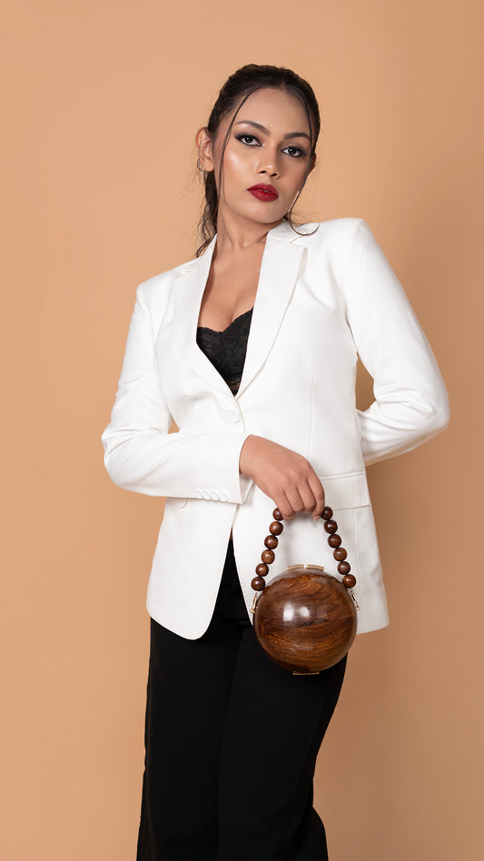 A sophisticated white blazer with precise tailoring, featuring peak stitching along the notch lapel for an elevated look.

