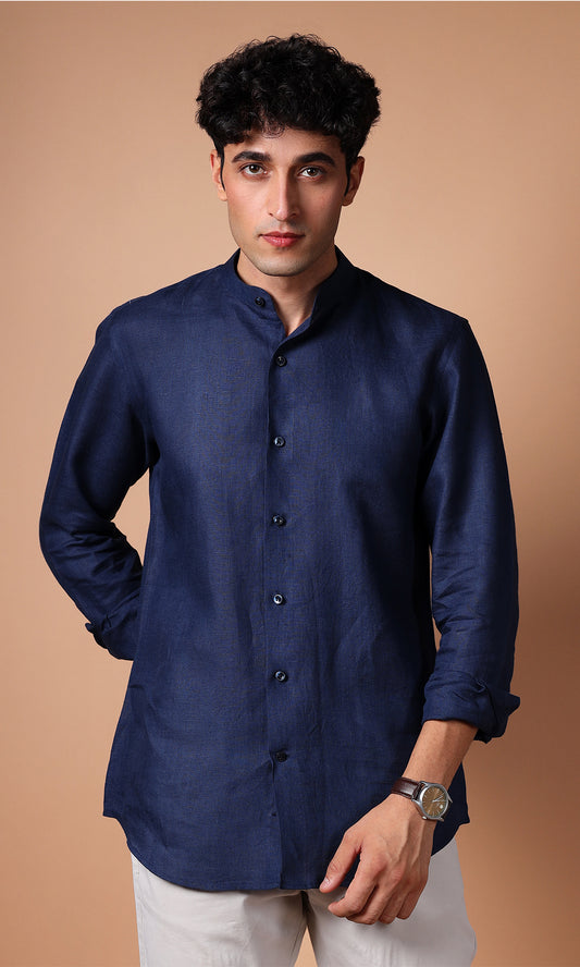 Front view of a model in a navy blue linen shirt, showing a polished and professional style