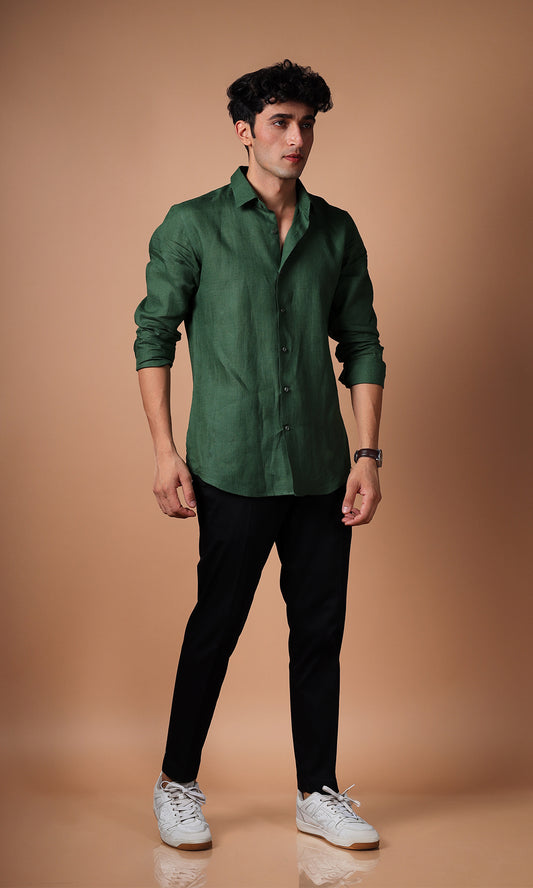 Model in an olive green linen shirt, standing in a confident pose, styled for versatility.