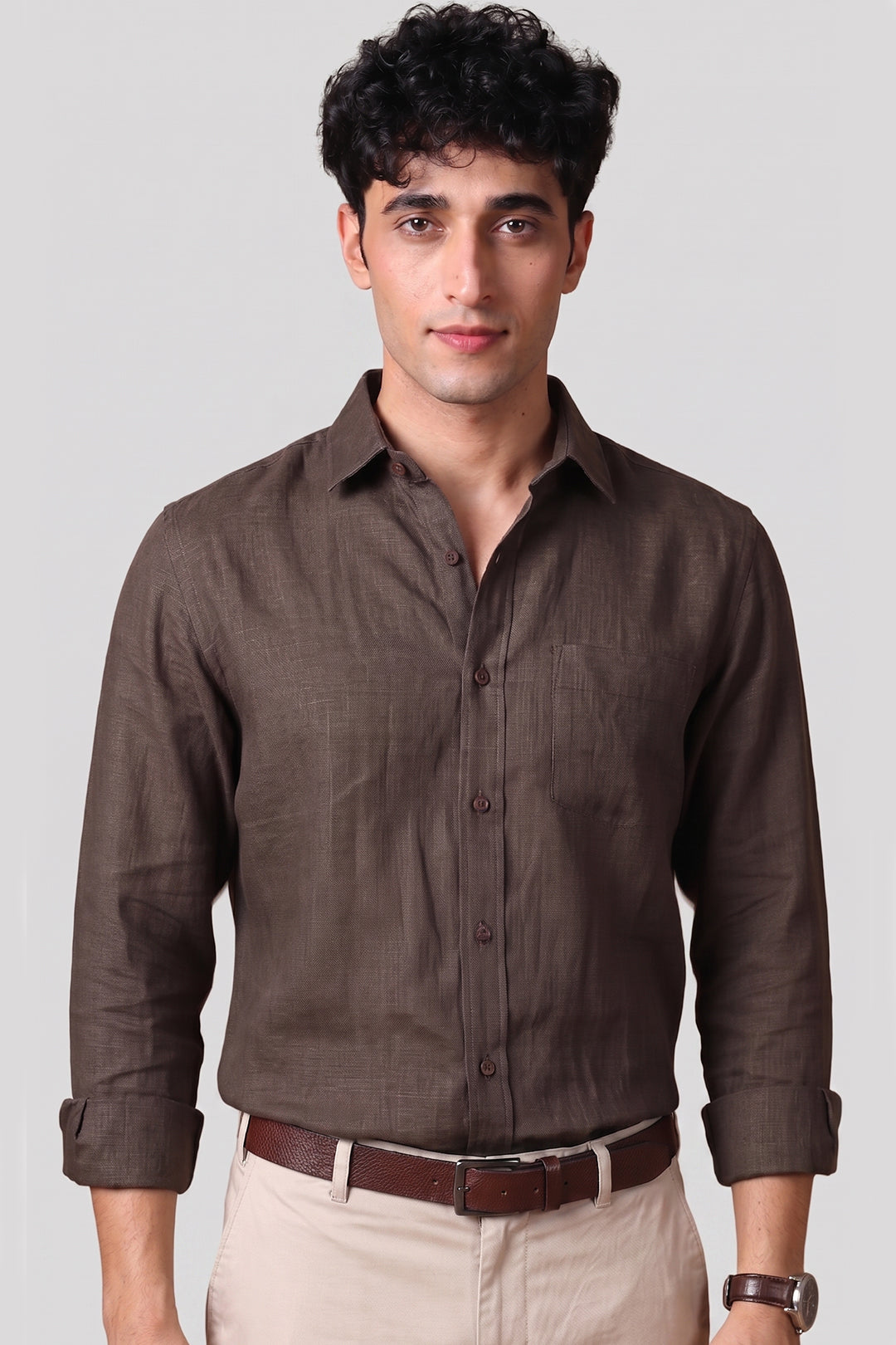 Bison Brown pure linen shirt for men, full front view with sleeves rolled, classic spread collar, chest pocket, styled with beige trousers and brown leather belt, by BWO