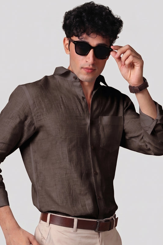 Bison Brown pure linen shirt for men, styled with sunglasses and brown leather belt, spread collar worn open, chest pocket detail, paired with beige trousers, by BWO