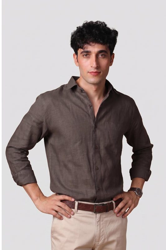 Bison Brown pure linen shirt for men, front view with sleeves rolled up, classic spread collar and chest pocket, styled with beige trousers and brown leather belt, by BWO