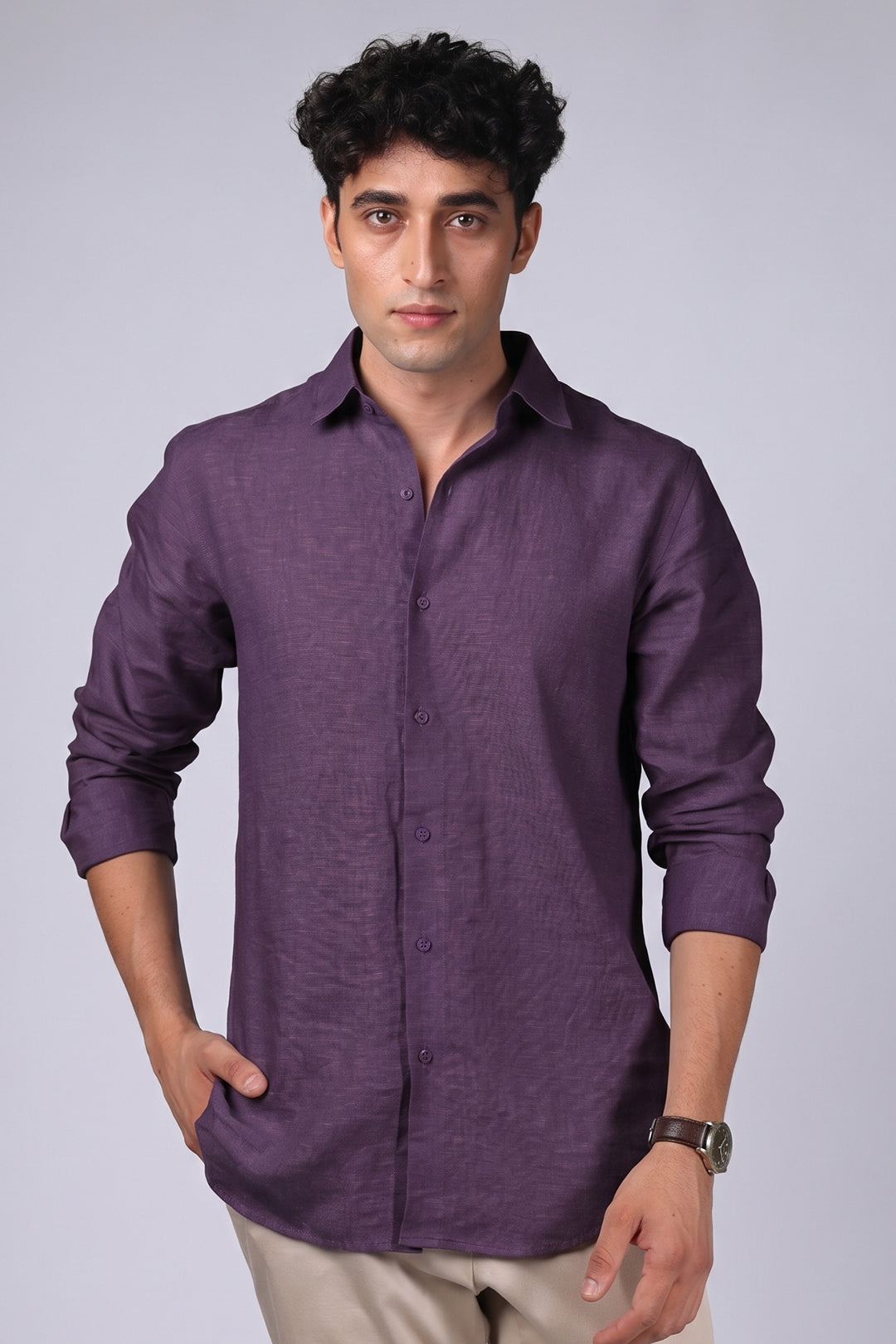 Deep plum pure linen shirt for men, full front view, spread collar, long sleeves, rounded hem, styled with beige trousers, by BWO