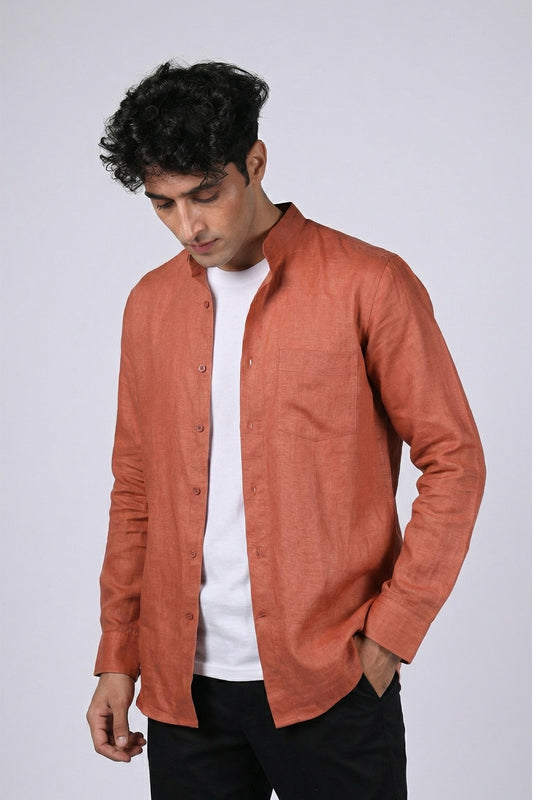 Rust pure linen shirt for men, front view with shirt open, band collar and full button placket visible, chest pocket detail, styled with black trousers, by BWO