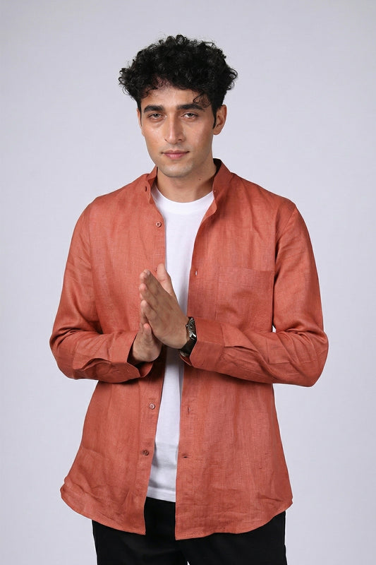 Rust pure linen shirt for men, front view worn open over white tee, band collar with chest pocket, long sleeves, styled with black trousers, by BWO
