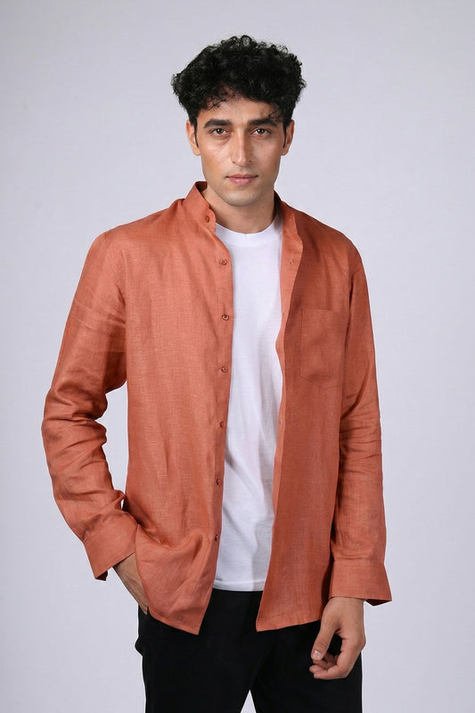 Rust pure linen shirt for men, front view worn open over white tee, band collar and chest pocket visible, styled with black trousers, by BWO